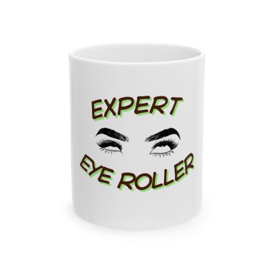 ⁠A white coffee mug with a graphic design of a pair of eyes rolling upward with long eyelashes, framed by arched text “Expert Eye Roller”