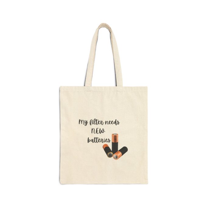 Beige tote bag with text "My gifts need no batteries" and illustrations of lipstick.