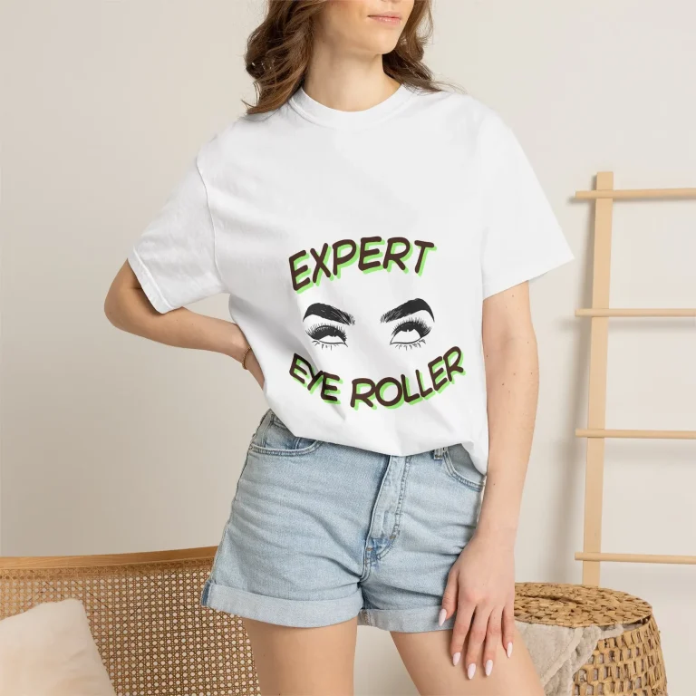 ⁠A model wearing a white Probably Not Sorry t-shirt featuring a graphic design of rolling eyes and the text Expert Eye Roller