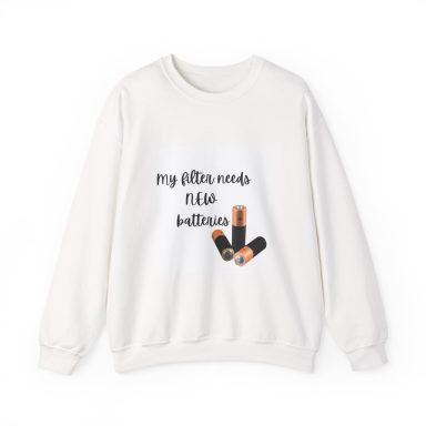 White crewneck sweatshirt featuring black cursive text that reads "my filter needs new batteries" alongside an graphic of three batteries.