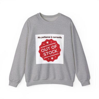 Grey crewneck sweatshirt featuring the text "My patience is currently" above a distressed, star-accented red circular badge “out of stock” 